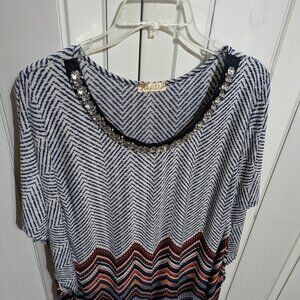 Women's Jeweled neckline blouse.